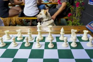 Participants play chess at the Los Feliz Chess Club located at Verdugo Bar 3408 Verdugo Rd, Los Angeles.