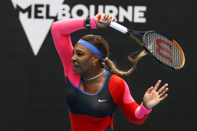 United States' Serena Williams makes a forehand return to Germany's Laura Siegemund during their first round match at the Australian Open tennis championship in Melbourne, Australia, Monday, Feb. 8, 2021.(AP Photo/Rick Rycroft)
