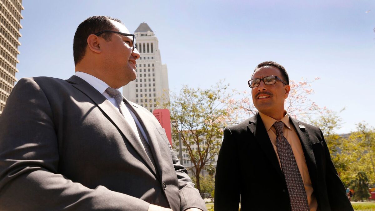 Marco Contreras, right, with attorney Ricardo Perez, who worked with Loyola Law School's Project for the Innocent depart Los Angeles Superior Court after a judge released Contreras on Tuesday.