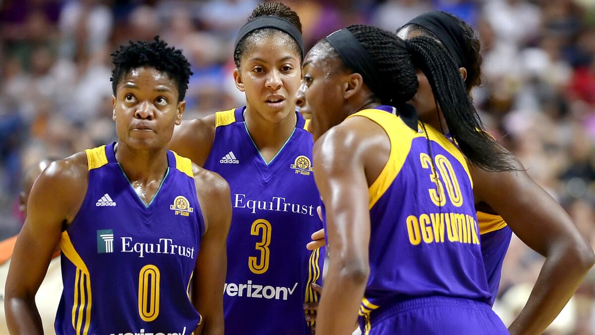 Sparks forward Nneka Ogwumike (30) talks to teammates, including Alana Bear (0) and Candace Parker (3) during a game eaerlier this week.