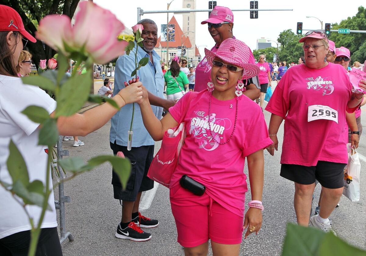 Breast cancer survivor Jacqueline Spears-Williams smiles at the finish of the 15th Annual Susan G. Komen St. Louis Race for the Cure in June. A new study finds that black women tend to be sicker than white women at the time of their diagnosis.