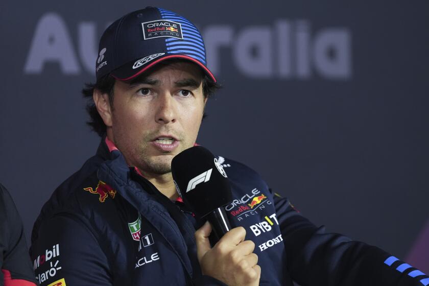 Red Bull driver Sergio Perez of Mexico answers questions during a press conference ahead of the Australian Formula One Grand Prix at Albert Park, Melbourne, Australia, Thursday, March 21, 2024. (AP Photo/Asanka Brendon Ratnayake)