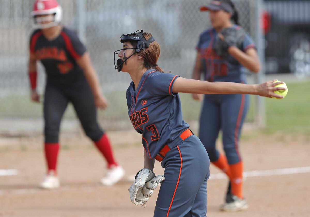 Los Amigos pitcher Nathalie Gonzalez makes a pitch during a Garden Grove League softball game against Loara on Friday.