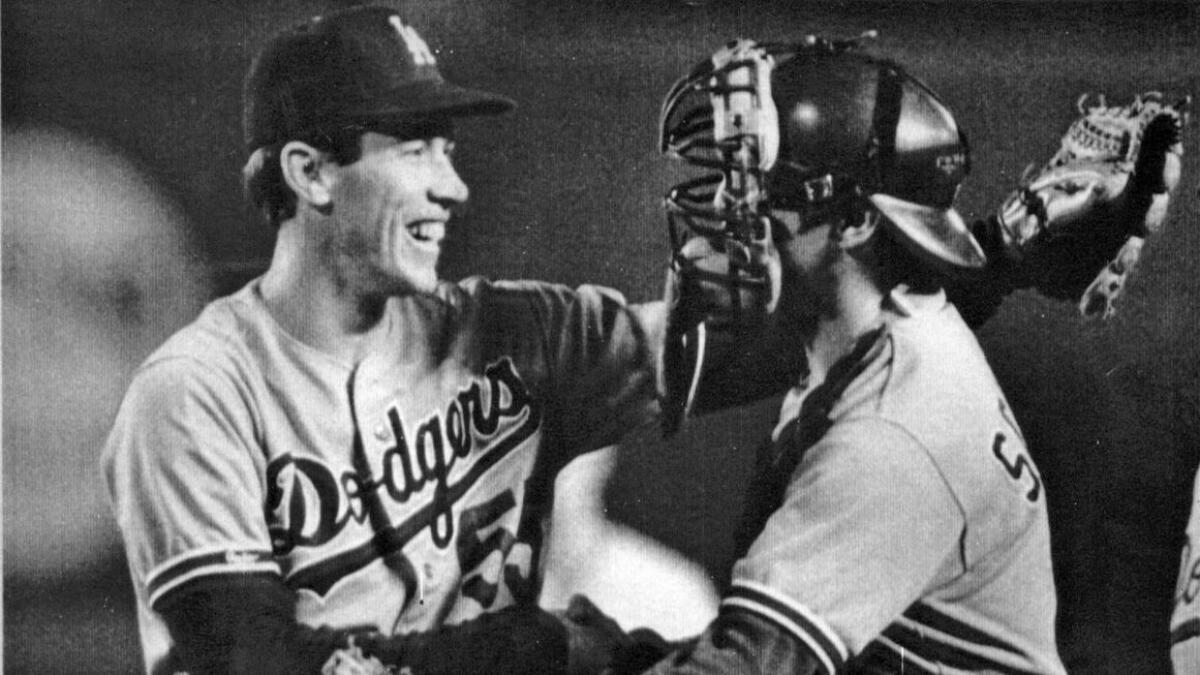 Dodger pitcher Orel Hershiser is congratulated by catcher Mike Scioscia after breaking former Dodger Don Drysdale's 20-year-old record of 58 consecutive scoreless innings. Hershiser shut out the San Diego Pardres to bring his total of scoreless innings to 59 on Sept. 28, 1988.