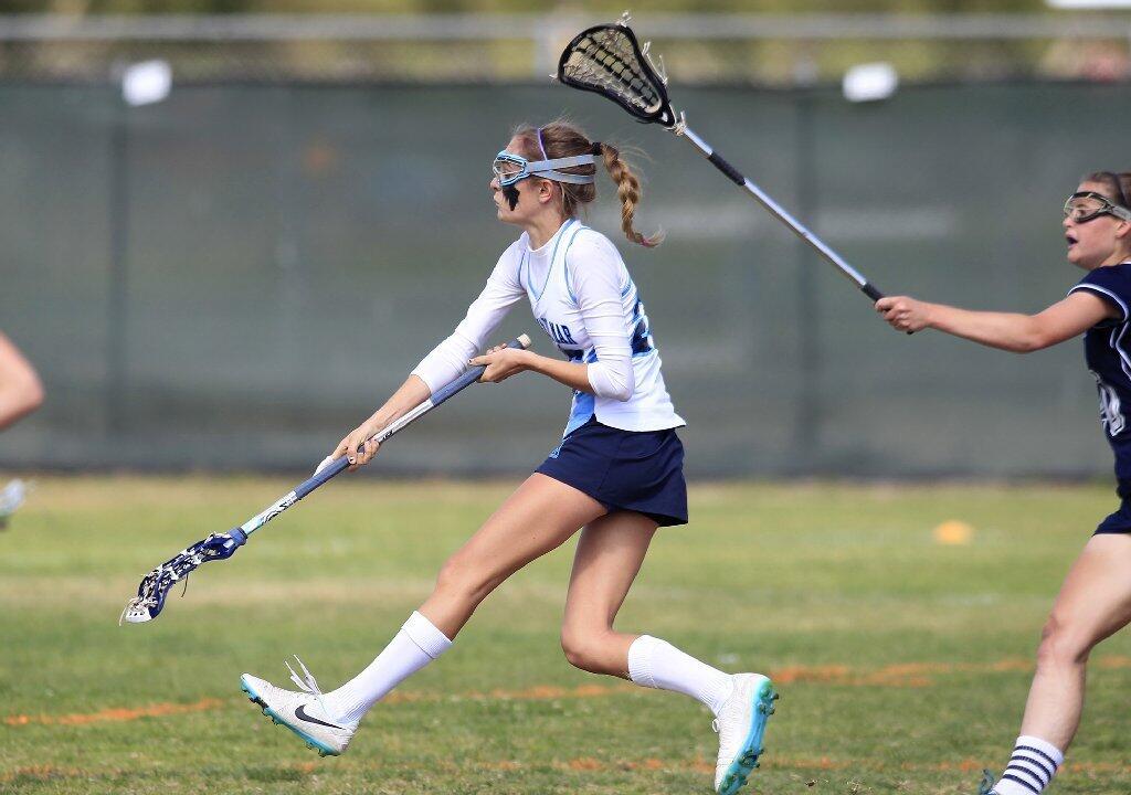 Corona del Mar High's Kennedy Mulvaney scores a goal against Newport Harbor during the Battle of the Bay game on Friday.