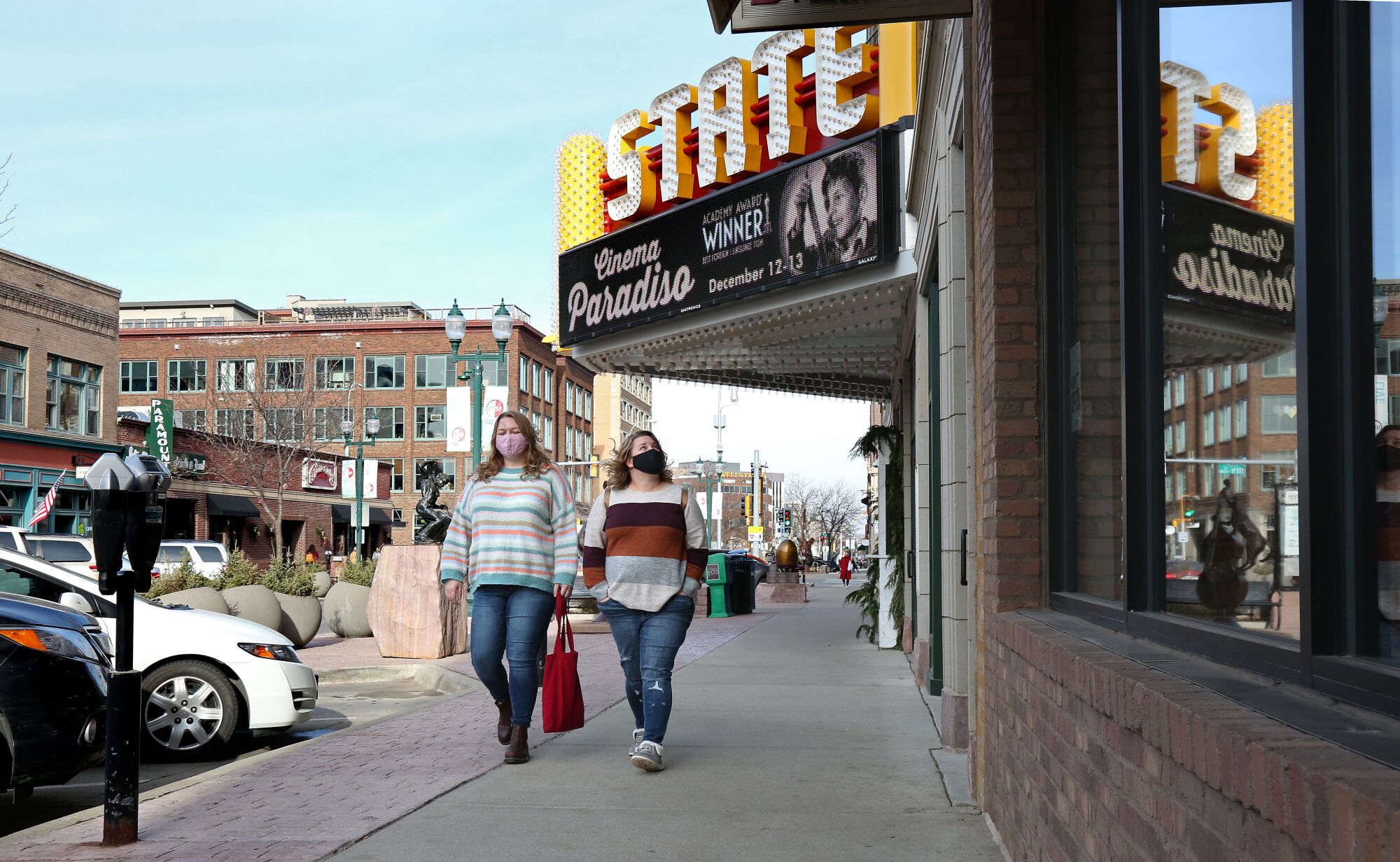 Residents walk along Phillips Ave, a main commercial street in downtown Sioux Falls.