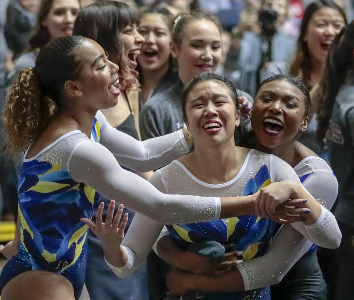 ANAHEIM, CA, SATURDAY, JANUARY 4, 2020 The 2020 UCLA gymnast Samantha Sakti is overcome with emotion after posting a high score on the balance beam at the Collegiate Challenge gymnastics meet at the Anaheim Convention Center. (Robert Gauthier/Los Angeles Times)