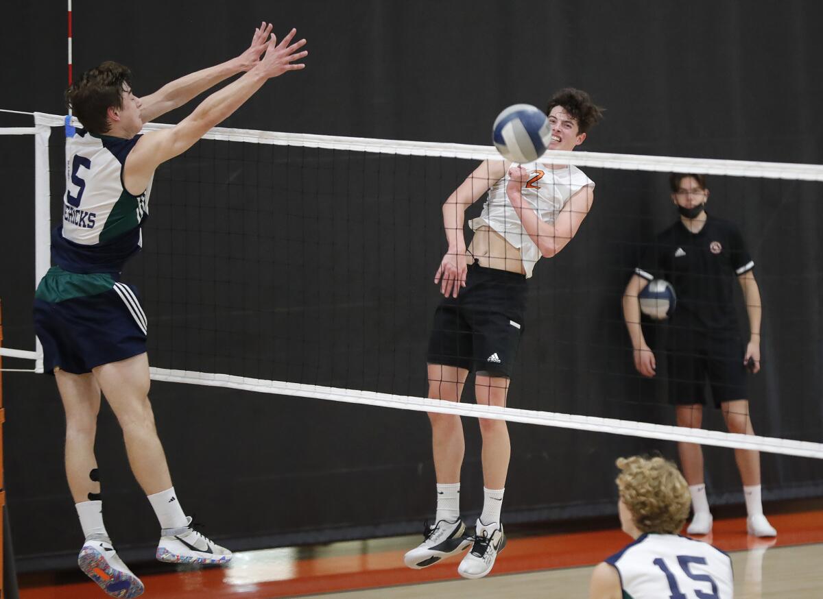 Huntington's Cayman LaFontaine (2) kills the ball cross-court against La Costa Canyon on Tuesday.