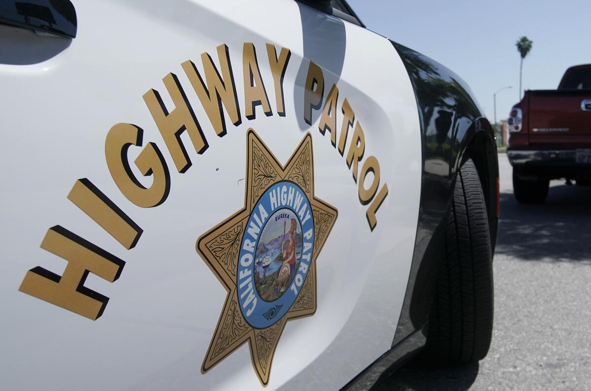 A close-up of the logo on the door of a California Highway Patrol car