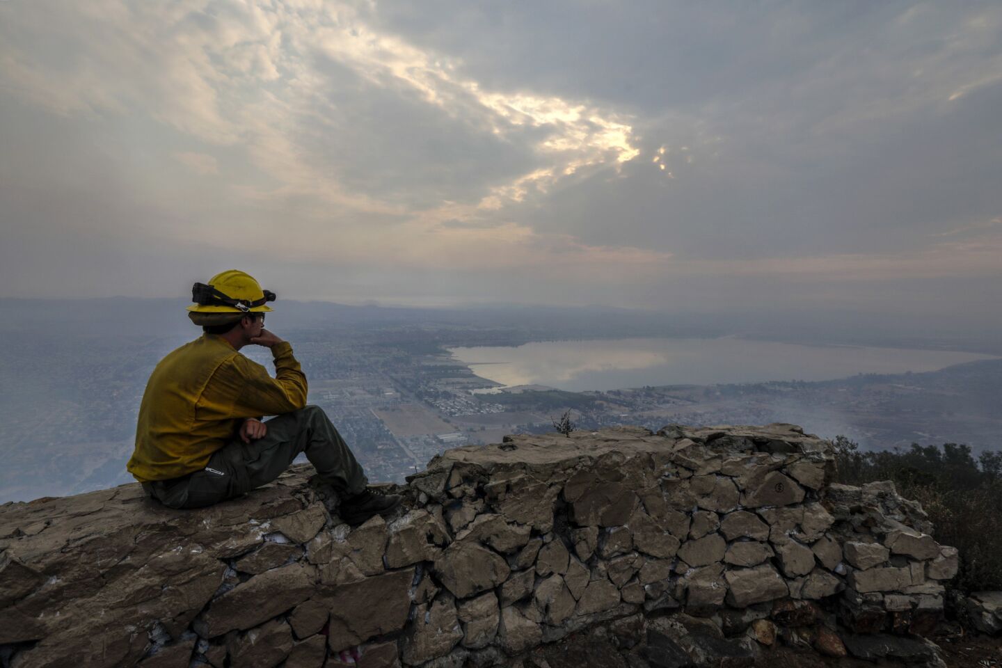 Firefighter Jon Polansky rest after working an overnight shift at a lookout on Ortega Highway above Lake Elsinore.