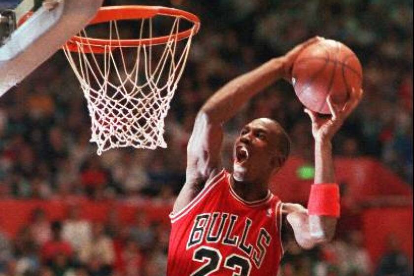 Chicago Bulls' Michael Jordan takes part in the NBA All-Star Slam Dunk contest in Seattle in this Feb. 7, 1987 photo. (AP Photo/Kirthmon Dozier)
