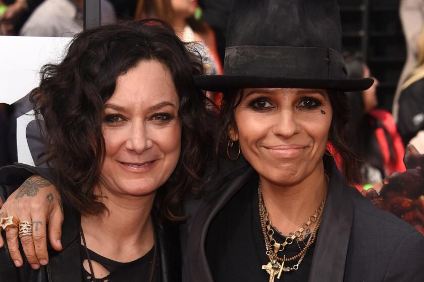 Sara Gilbert, left, and Linda Perry -- shown at the 2014 MTV Movie Awards -- are the parents of a new baby boy.