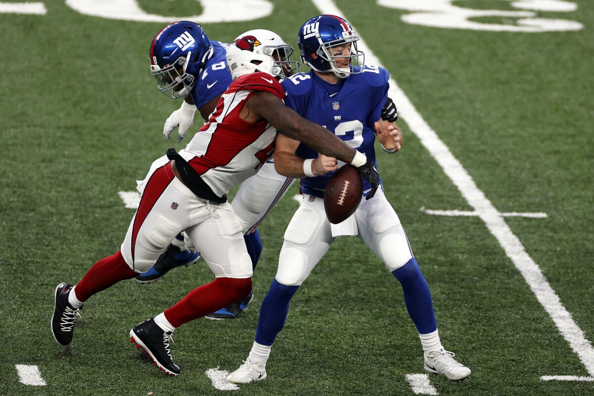 Arizona Cardinals outside linebacker Haason Reddick knocks the ball out of New York Giants quarterback Colt McCoy's hands.