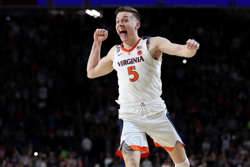 MINNEAPOLIS, MINNESOTA - APRIL 08: Kyle Guy #5 of the Virginia Cavaliers celebrate his teams 85-77 win over the Texas Tech Red Raiders to win the the 2019 NCAA men's Final Four National Championship game at U.S. Bank Stadium on April 08, 2019 in Minneapolis, Minnesota. (Photo by Streeter Lecka/Getty Images) ** OUTS - ELSENT, FPG, CM - OUTS * NM, PH, VA if sourced by CT, LA or MoD **