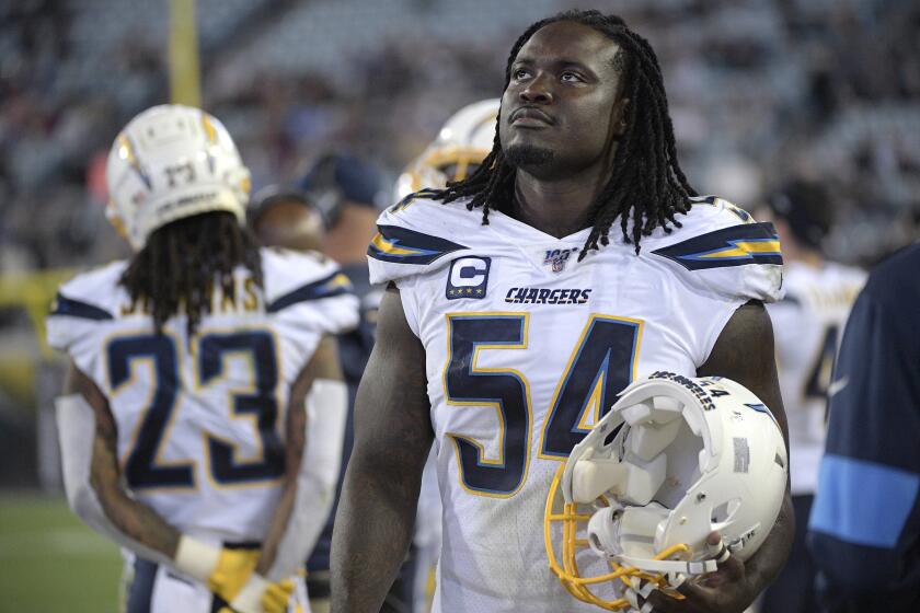 Los Angeles Chargers defensive end Melvin Ingram (54) watches from the sideline.