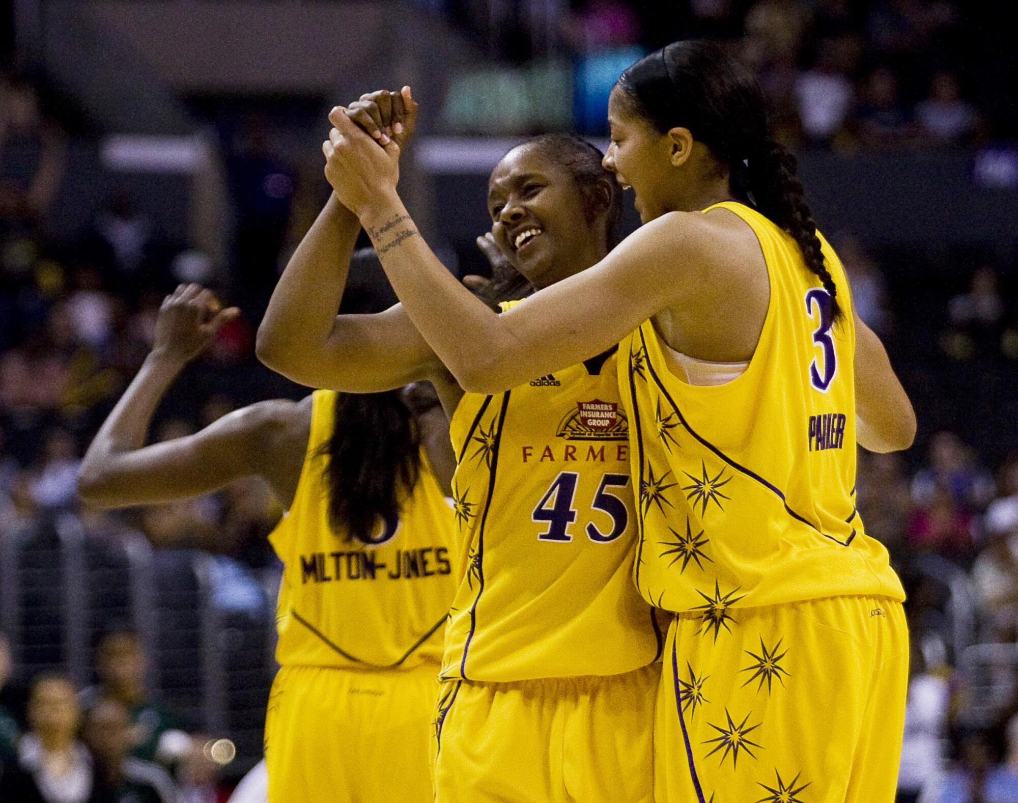 Noelle Quinn and Candace Park celebrate a Sparks win over the Storm in 2009. 