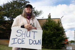 Deirdre Anglin, community member from Chicago, takes part in a demonstration