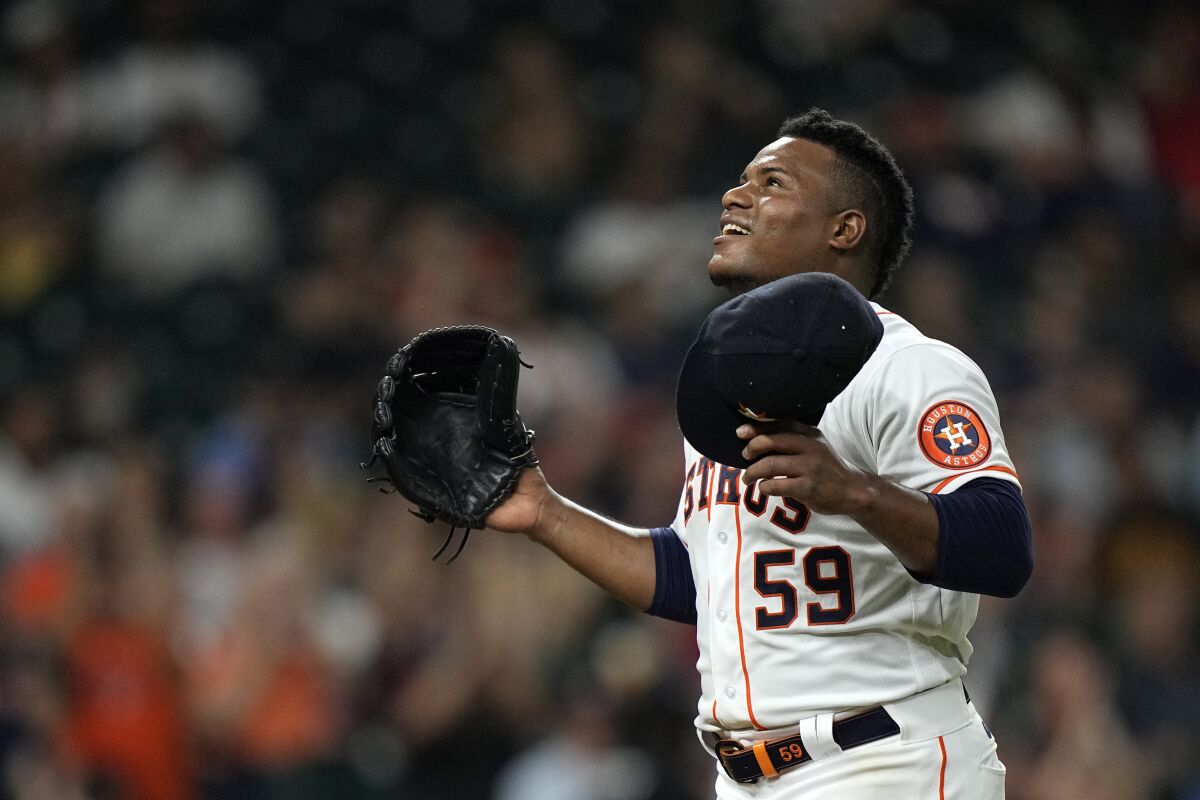 Houston Astros starting pitcher Framber Valdez reacts after striking out Boston Red Sox's Enrique Hernandez during the seventh inning of a baseball game Wednesday, June 2, 2021, in Houston. (AP Photo/David J. Phillip)