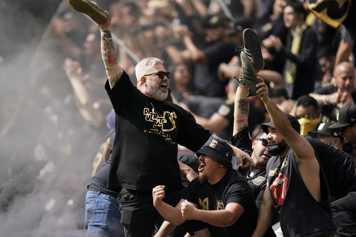 LAFC fans celebrate a goal by Carlos Vela during the first half against Colorado on Saturday.
