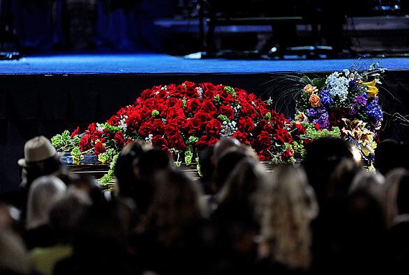 Michael Jackson's casket, covered in roses, was taken to Staples Center.