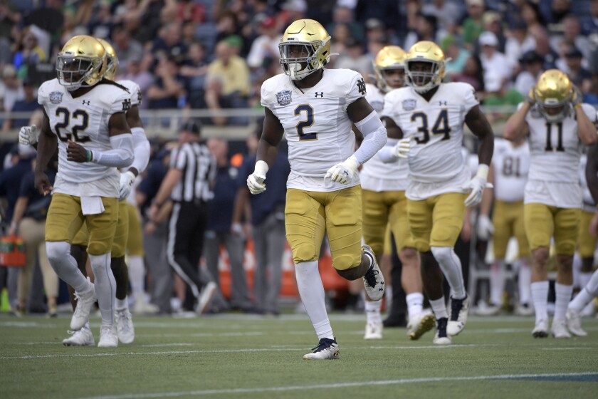 Notre Dame linebacker Jordan Genmark Heath sets up for a play.
