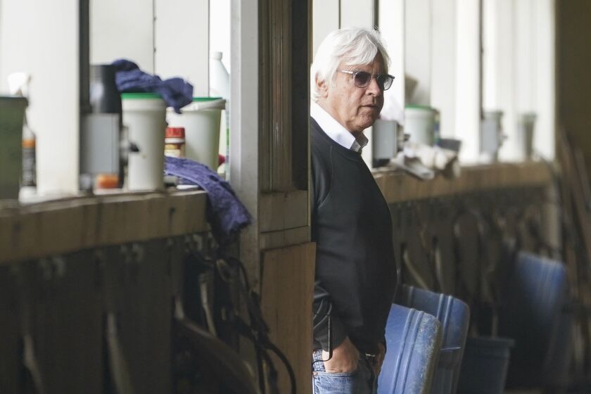Trainer Bob Baffert surveys the stables as workouts continue ahead of the Belmont Stakes horse race, Friday, June 9, 2023, at Belmont Park in Elmont, N.Y. (AP Photo/John Minchillo)