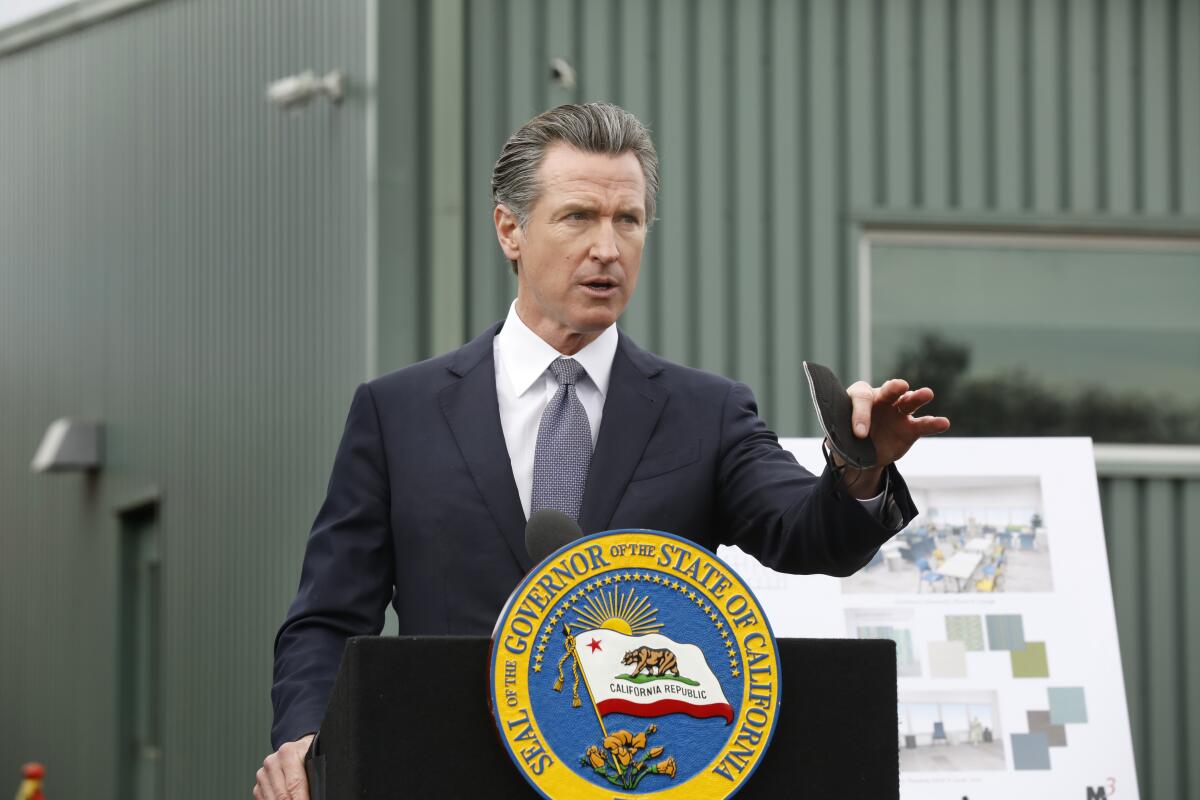 California Gov. Gavin Newsom holds a news conference.