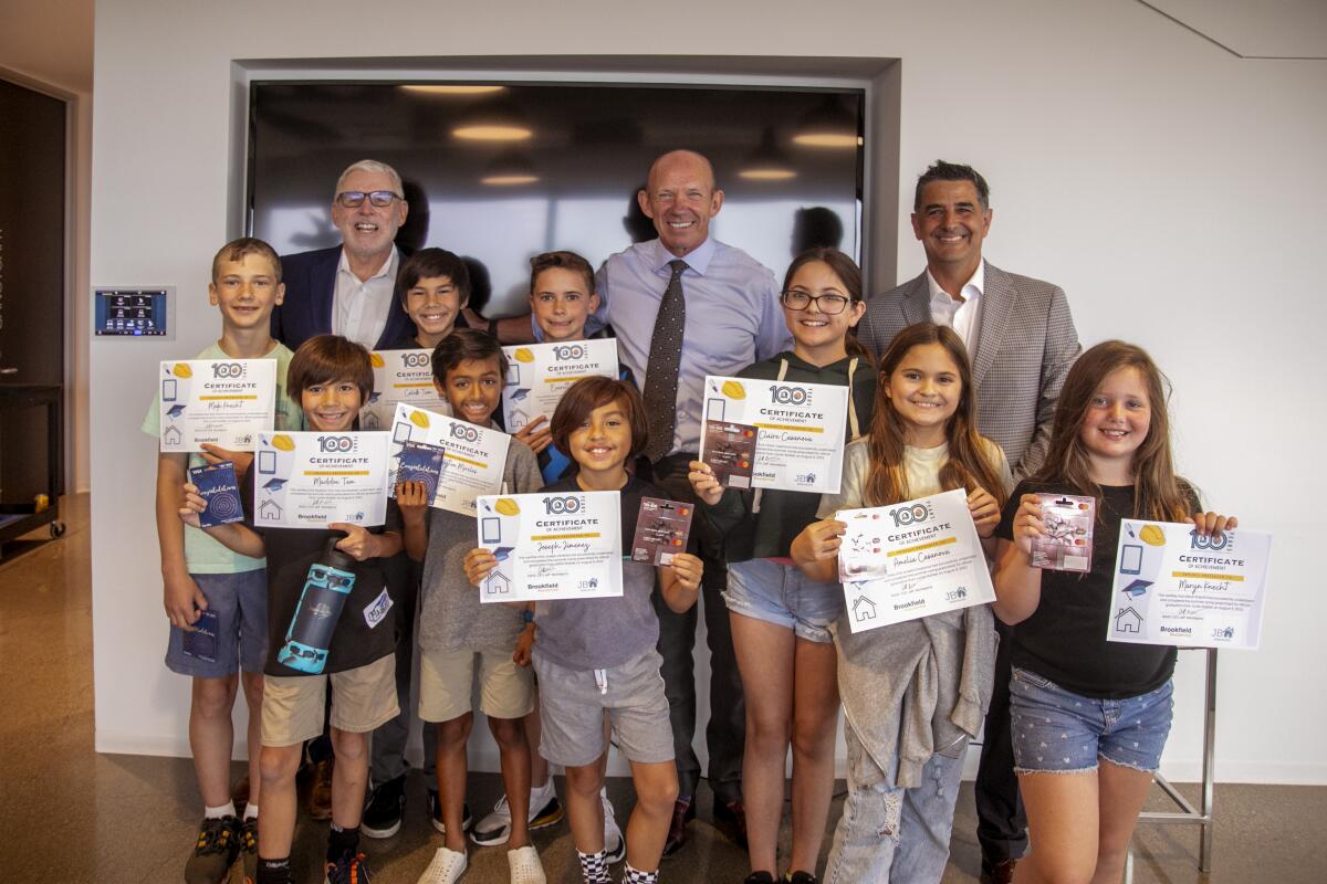 Junior Builders Campers with executives of the Building Industry Assn. of Southern California and Brookfield Properties.