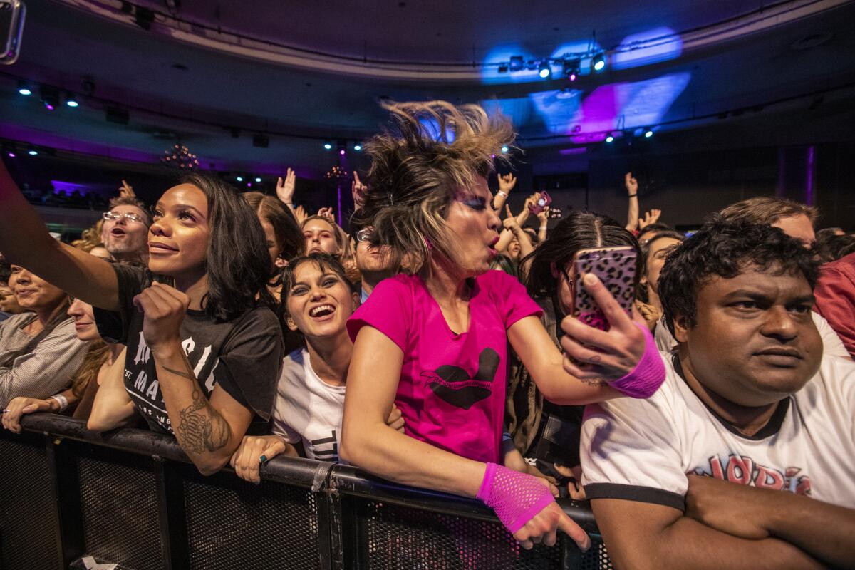 Fans take in the performance.