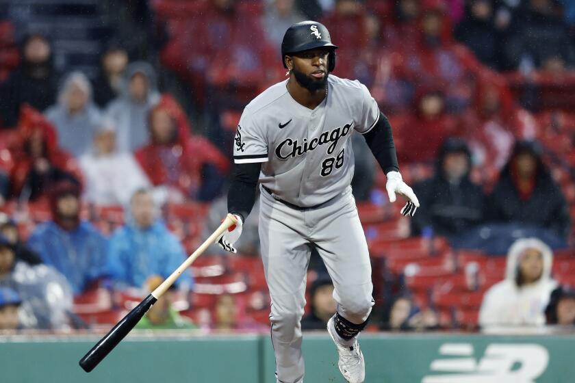 Chicago White Sox's Luis Robert Jr. runs on his solo home run during the ninth inning of a baseball game against the Boston Red Sox, Saturday, Sept. 23, 2023, in Boston. (AP Photo/Michael Dwyer)