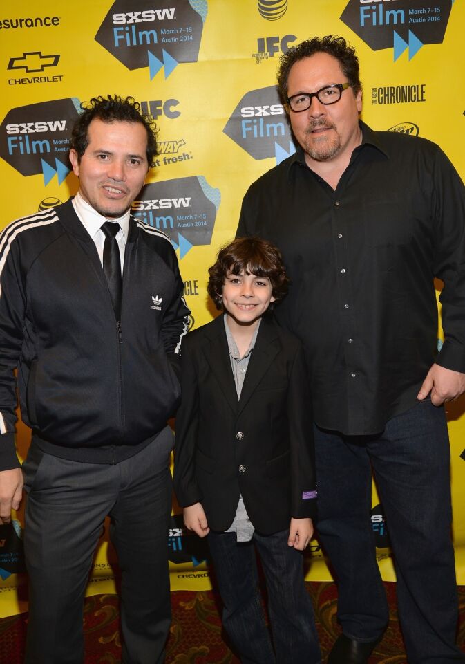 Actor John Leguizamo, actor Emjay Anthony and director Jon Favreau arrive for the premiere of "Chef."