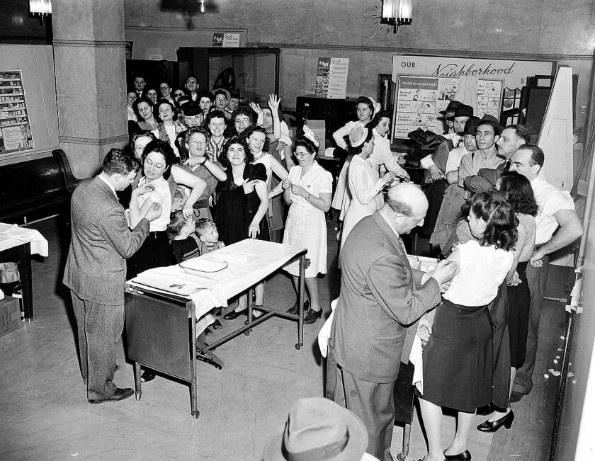 People crowd into a room to get vaccinated against smallpox in New York City in 1947. 