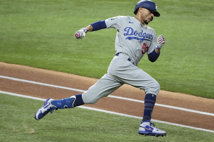 Arlington, Texas, Sunday, October 25, 2020 Los Angeles Dodgers right fielder Mookie Betts (50) hustles to second base for a double in game five of the World Series at Globe Life Field. (Robert Gauthier/ Los Angeles Times)