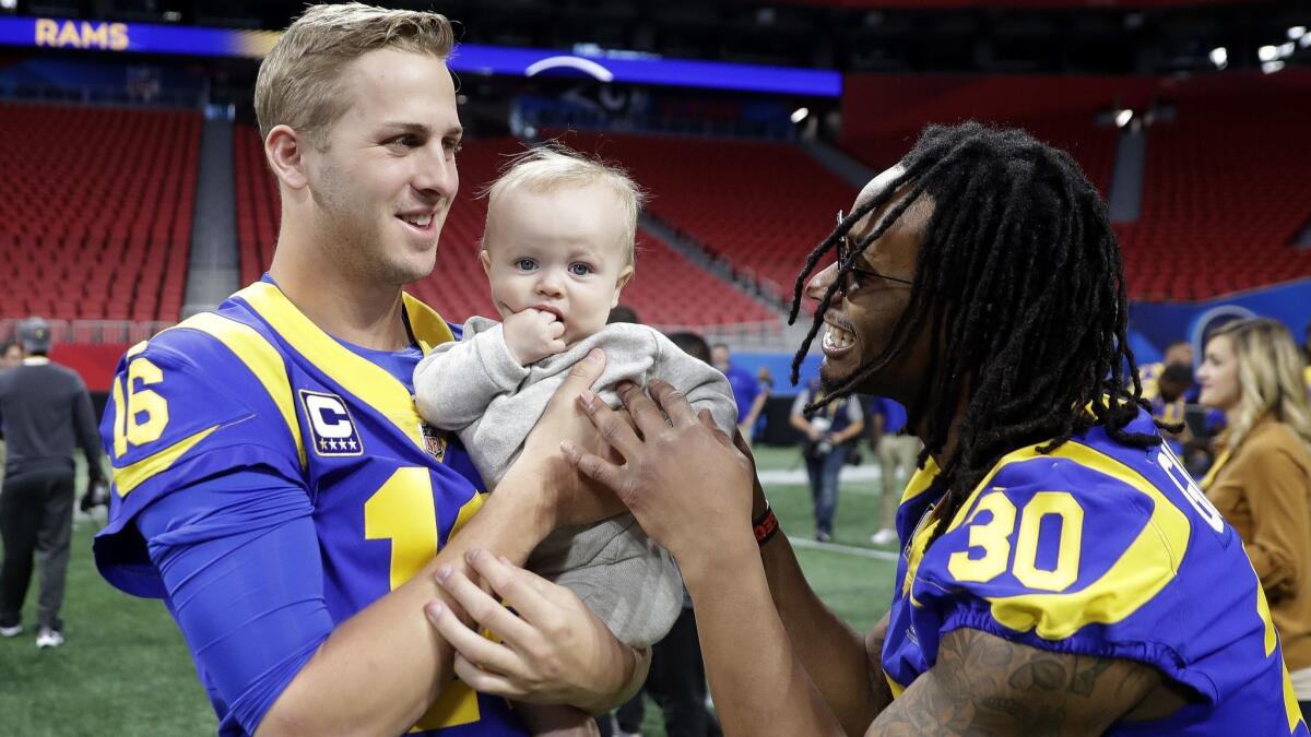 Rams quarterback Jared Goff (16) and running back Todd Gurley play with Cooper Kupp Jr., during a walk-through at the Mercedes-Benz Stadium on Saturday.