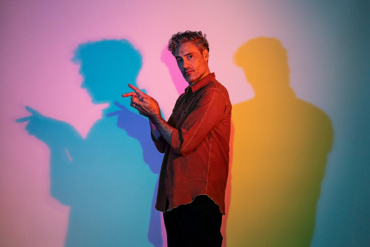 "Jojo Rabbit" director Taika Waititi playfully makes shadow rabbits on the wall. 