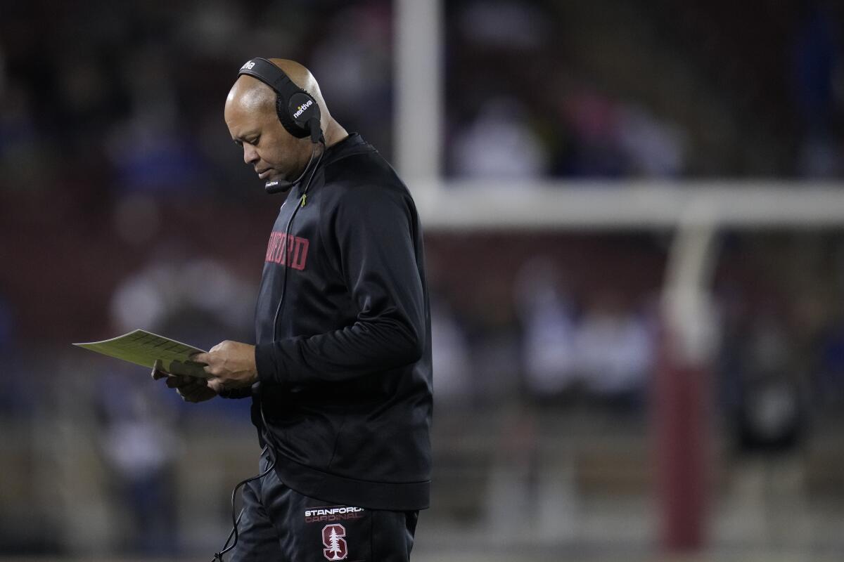 Stanford coach David Shaw stands near the sideline.