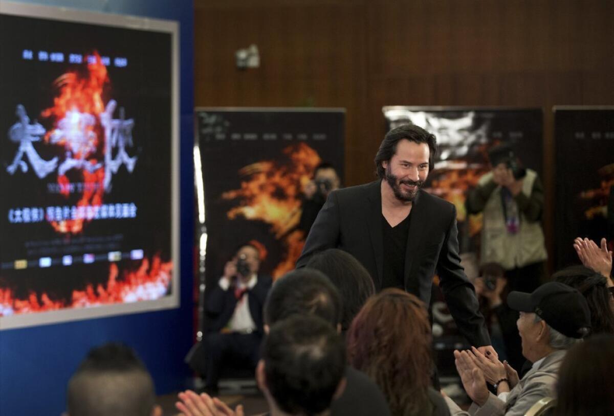 Keanu Reeves makes an appearance in Beijing on Saturday to promote his new movie "Man of Tai Chi"