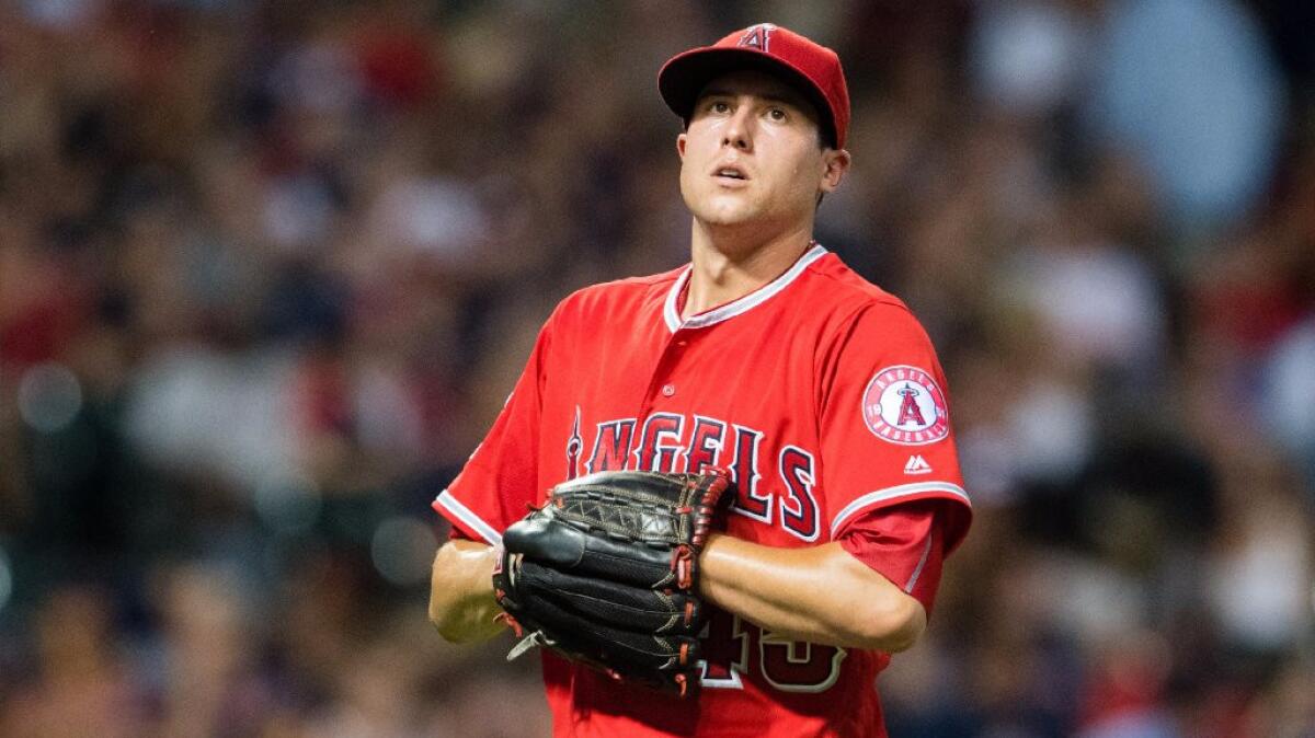 Starter Tyler Skaggs leaves the field after giving up four runs in the fifth inning of the Angels' 13-3 loss to the Cleveland Indians on Friday.