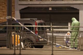 Police and inspectors work in an area where a shooting took place in the center of Brussels, Monday, Oct. 16, 2023. Belgian police say that two people are dead in central Brussels after several shots were fired. (AP Photo/Nicolas Landemard)
