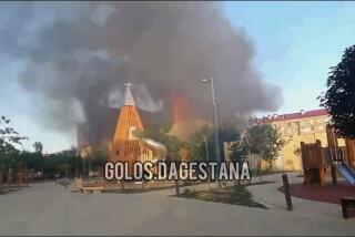 This photo taken from video released by Golos Dagestana shows smoke rises following an attack in Makhachkala, republic of Dagestan, Russia, Sunday, June 23, 2024. Russian state news agency RIA Novosti says that armed militants attacked two Orthodox churches, a synagogue and a traffic police post in Russia's southern republic of Dagestan, killing a priest and six police officers. (Golos Dagestana via AP)