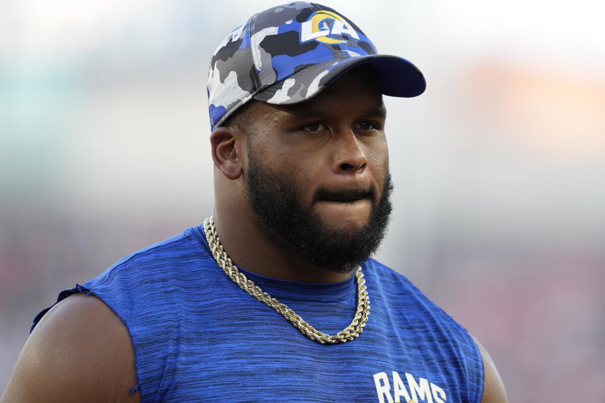 Rams defensive tackle Aaron Donald watches during the team's preseason game in Cincinnati on Aug. 27, 2022.