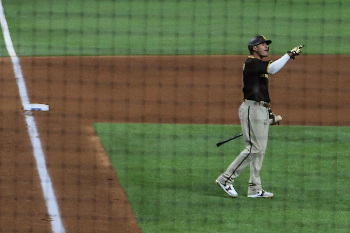 Padres third baseman Manny Machado yells toward Dodgers reliever Brusdar Graterol. 