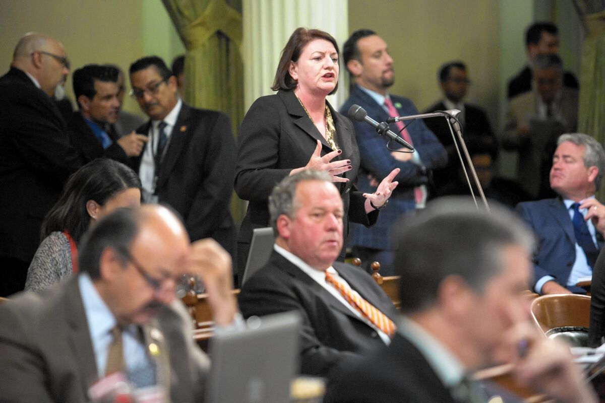 Assembly Speaker Toni Atkins, center, addresses fellow lawmakers during a discussion on a climate change bill hours before the end of the 2015 legislative session.