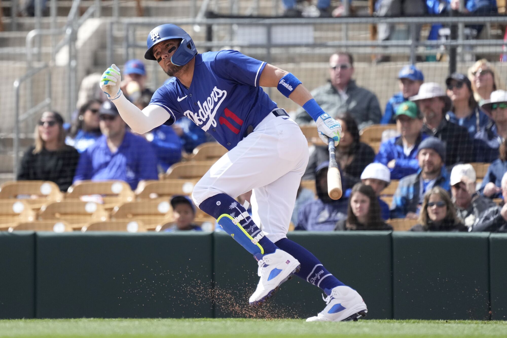 Miguel Rojas tries to run out a ground ball against the Chicago Cubs on Feb. 26 in Phoenix.