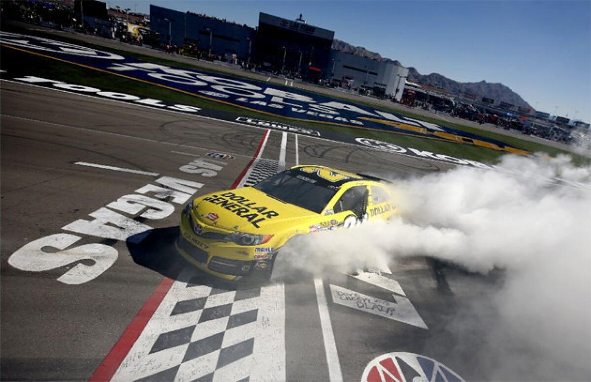 Matt Kenseth celebrates with a burn out after winning the NASCAR Sprint Cup Series race at Las Vegas Motor Speedway.