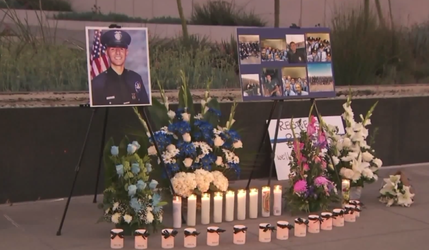 Mourners create a memorial for slain Los Angeles police officer Juan Jose Diaz on Saturday night in downtown Los Angeles.