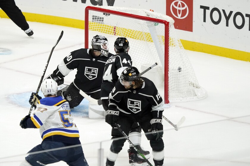 St. Louis Blues left wing David Perron, bottom left, scores past Los Angeles Kings goaltender Calvin Petersen, top left, during the third period of an NHL hockey game Friday, March 5, 2021, in Los Angeles. (AP Photo/Marcio Jose Sanchez)