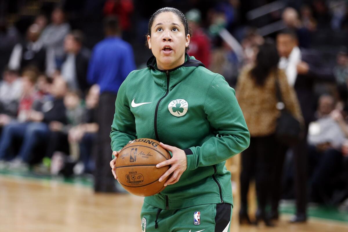 Boston Celtics assistant coach Kara Lawson on the court during warmups before a game against the Philadelphia 76ers.