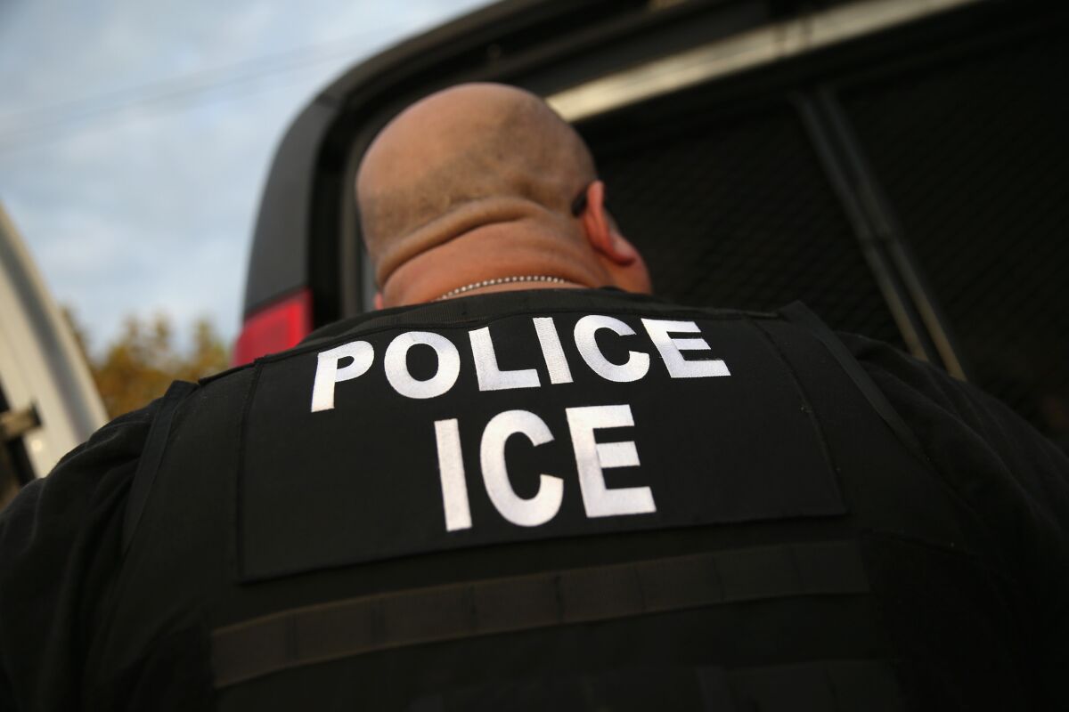 A U.S. Immigration and Customs Enforcement agent takes part in an operation in Los Angeles.