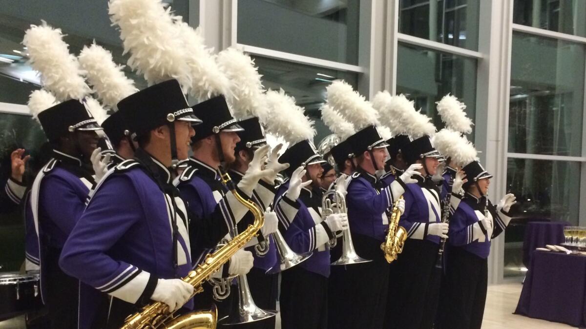 Members of the Northwestern band, after performing at tribute.